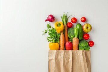 Background with recyclable brown paper shopping bag with fruits and vegetables on white table. Top view. Horizontal composition.