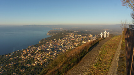 View over the city at mediterranean coast from Monte Sant'Elia viewpoint with three white crosses...
