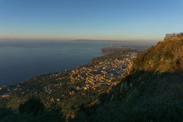 View over the city at mediterranean coast from Monte Sant'Elia viewpoint during golden hour, Palmi,...