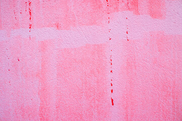 Abstract background of a weathered red paint wall cement texture