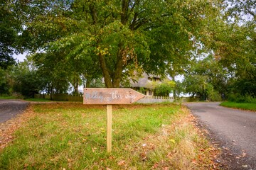 sign directing us to go through the park to see the woods