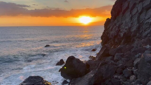 Scenic view of the sunset scene over the Pacific ocean as seen from Punta de Lobos beach, Chile
