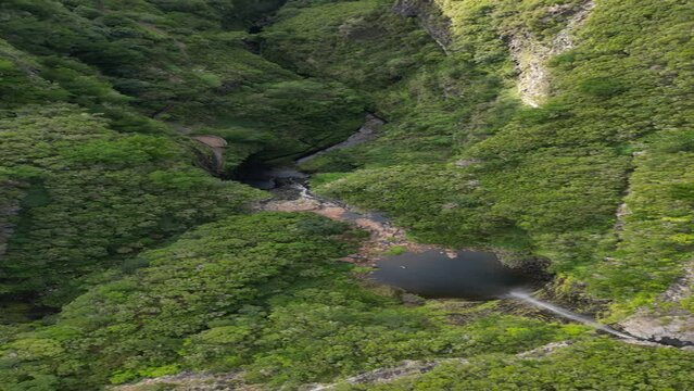 Top down drone footage over Lagoa do Vento and Risco Waterfall in Madeira island, Portugal