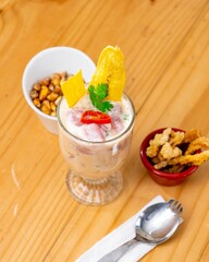 a spoon and fork on a table near a bowl of food