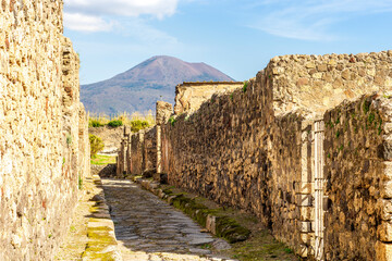 ancient buildings and walls in archeological excavation In Pompeii , Italy. Streets and historical...
