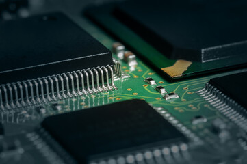 Closeup of Printed Circuit Board with processor, integrated circuits and many other surface mounted...