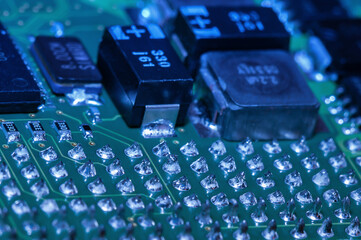 Closeup of Printed Circuit Board with processor, integrated circuits and many other surface mounted...