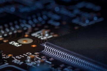 Closeup of Printed Circuit Board with processor, integrated circuits and many other surface mounted...