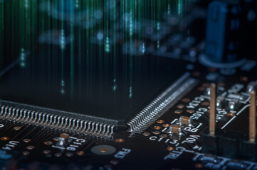 Closeup of Printed Circuit Board with processor, integrated circuits and many other surface mounted passive electrical components.