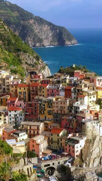 Drone vertical video of cliffside architecture in Cinque Terre Italy