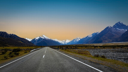 The  road way  travel with mountain landscape view of blue sky background over Aoraki mount cook...