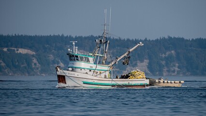 a boat that has been loaded with bananas on water in a bay