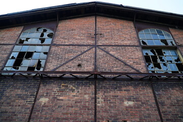 Old red brick façade of an abandoned factory ruin in Hanover Ledeburg, Lower Saxony, Germany