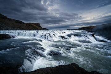 a waterfall at dusk, just after the rain came to its end
