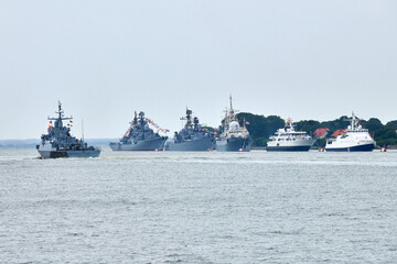 Military parade of Russian naval forces warships along coastline, seafaring tradition of military...