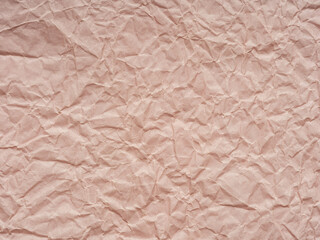 A ballet of blush and beige, this paper's crinkled tapestry dances with the soft whispers of serenity