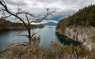 Landscape of fjords and mountains in Norway on a rainy day