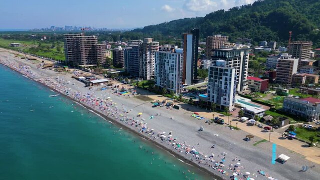 Drone footage of the coastal buildings on Gonio Beach on a sunny day in Gonio, Georgia