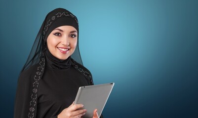 A saudi character working on tablet computer