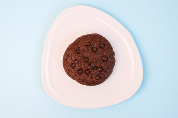 Chocolate Cookies On Plate Over Blue Background