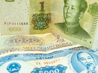 Closeup of China and Vietnam currency banknotes.