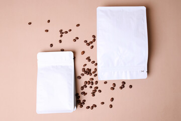 Flat Lay Of White Coffee Pouch With Coffee Beans For Advertisement Mockup Isolated On Brown...