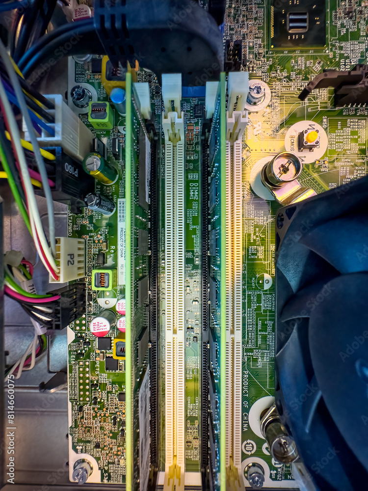 Poster close up of circuit board with microchips and other computer parts. ram memory slots
