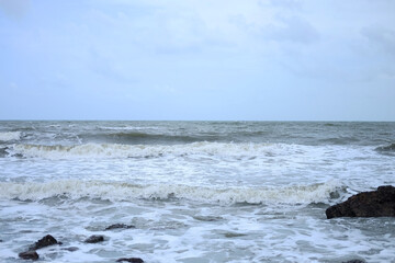 Beautiful landscape of Rocky coastline and blue sea with cloud storm on the sky in Thailand.Seascape concept 
