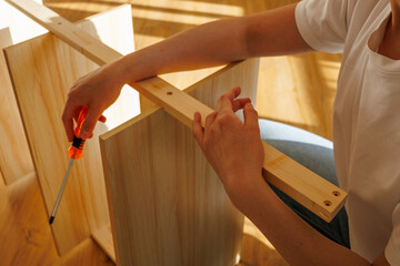 Self-assembly modern furniture by woman