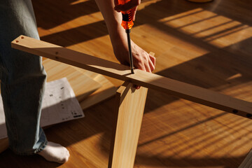 Self-assembly modern furniture by woman