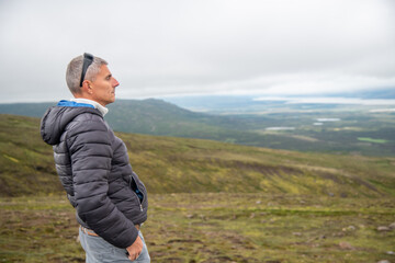 Man looking away at Iceland landscape in summer season