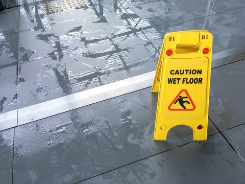 Yellow caution wet floor sign
