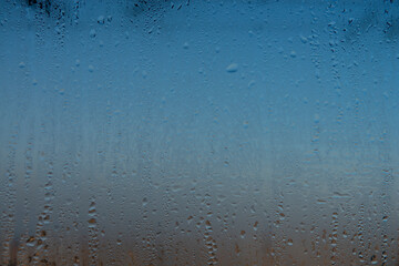 Water drops on the window, natural background, closeup of photo