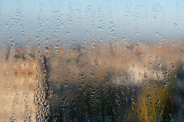 Water drops on the window, natural background, closeup of photo
