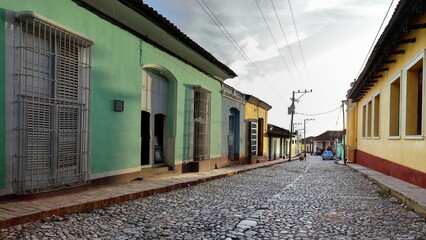 INCIDENTAL, NON RECOGNIZABLE PEOPLE IN THE IMAGE. Colonial houses on the cobbled Calle Boca Street,...