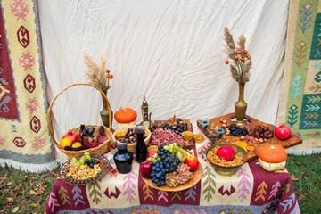 Table decorated with fresh fruits outdoors