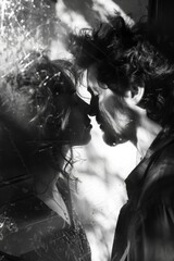 black and white photograph capturing couple in intimate moment with their faces close and eyes closed. emphasizes emotional depth and timeless nature of love, monochromatic lens, dia dos namorados