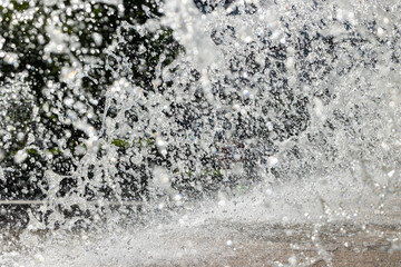 Texture of splashes and drops of water in a fountain