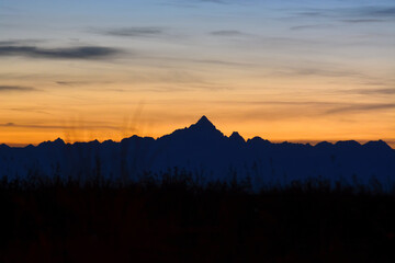 Piedmont, Italy the mountain range of the Alps with Mount Monviso at sunset