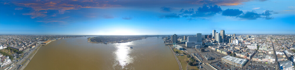 New Orleans, Louisiana - Panoramic aerial view of cityscape and Mississippi River at sunset