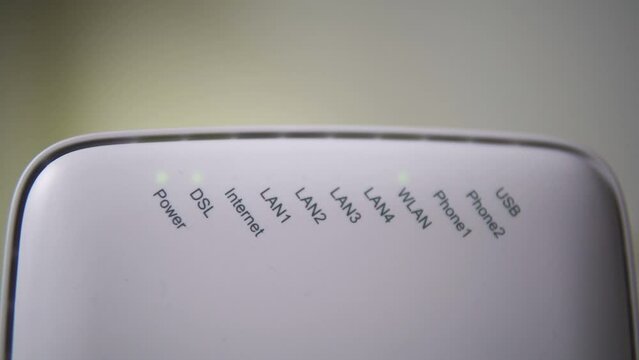 Correctly connected modem with flashing bulbs. The w-file works without problems. Connection. White modem, router on a black background. Technical support. place for text, monochrome background.