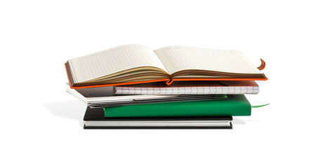 Open blank notepad. Stack of books isolated 