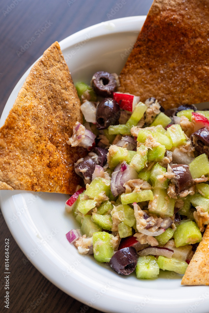 Wall mural Crunchy Salad with Tuna and Tortilla Chips in White Bowl