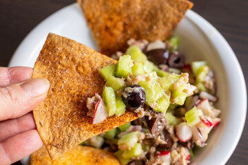 Crunchy Salad with Tuna and Tortilla Chips in White Bowl