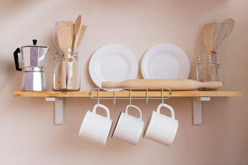 Wooden shelves with things in kitchen