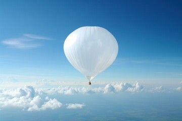 Obraz premium Tranquil white hot air balloon floats gracefully against a clear blue sky, above soft clouds
