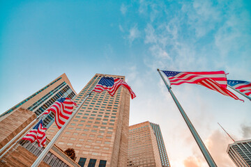 American flags against tall skyscrapers in Miami
