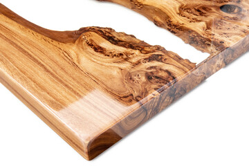 Live edge elm burl slab table top with central epoxy resin river on white background, combining...