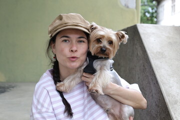 Beautiful young woman spending time with her doggy