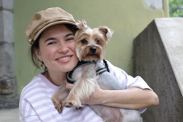 Beautiful young woman spending time with her doggy